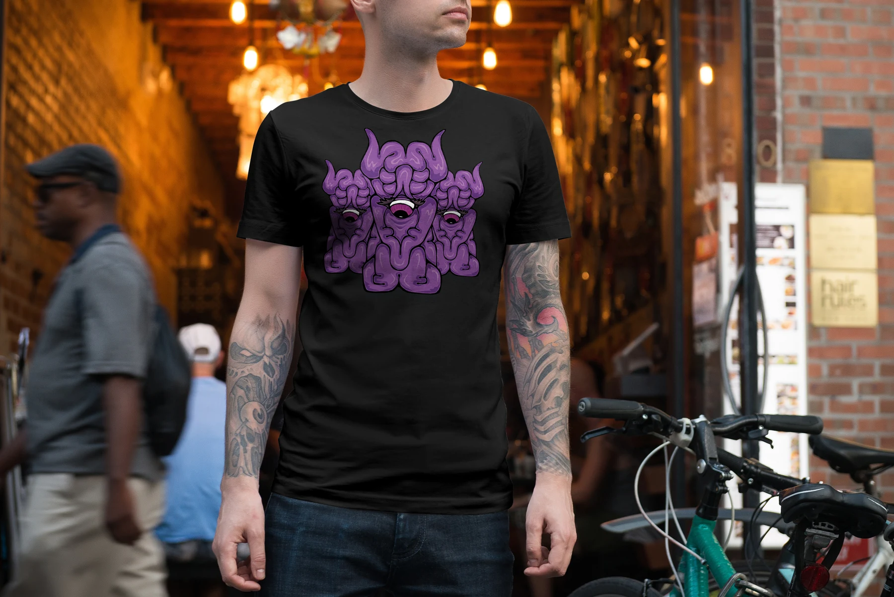 The Eye Men — a purple character on a T-shirt concept.